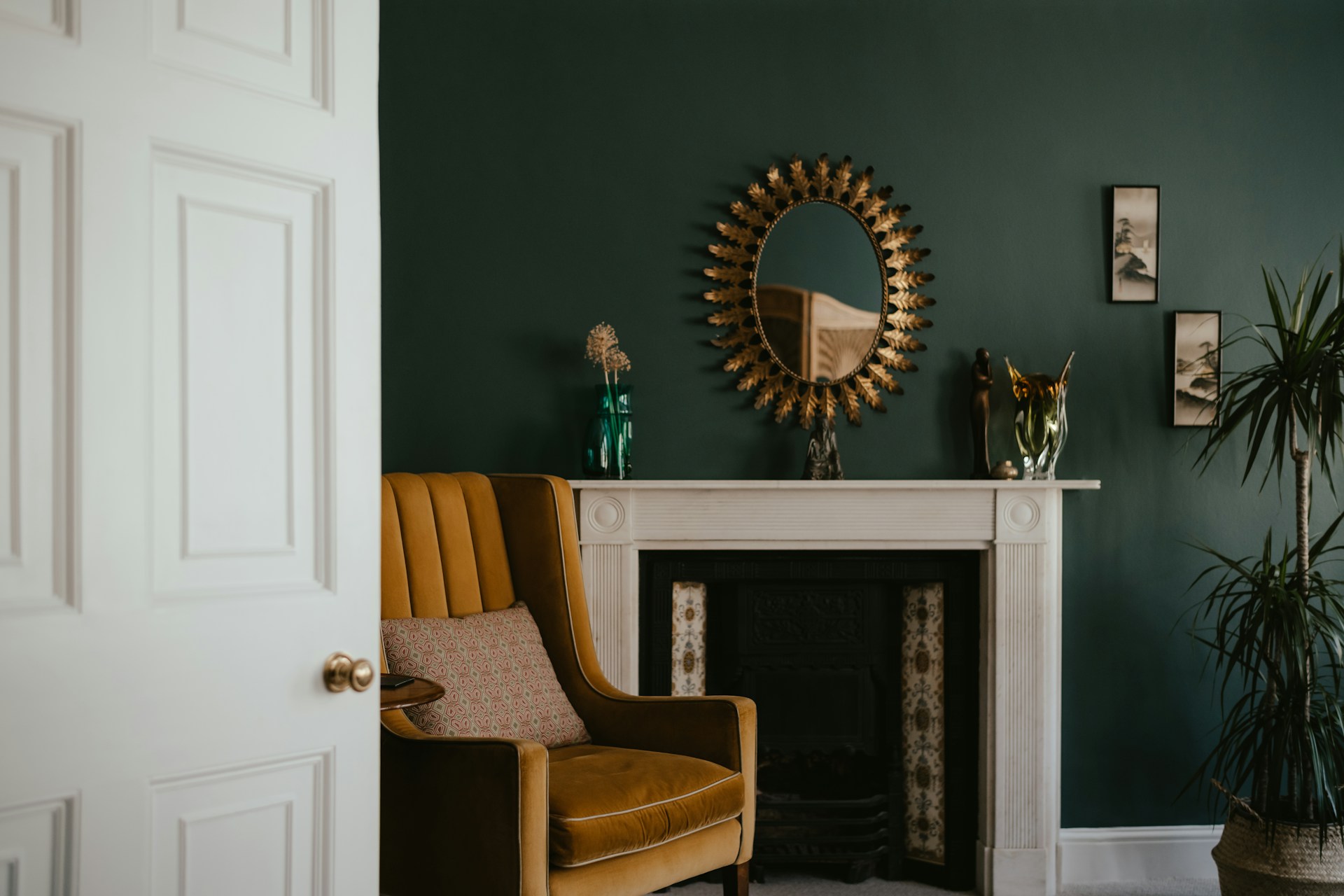 A fireplace corner with a mustard armchair