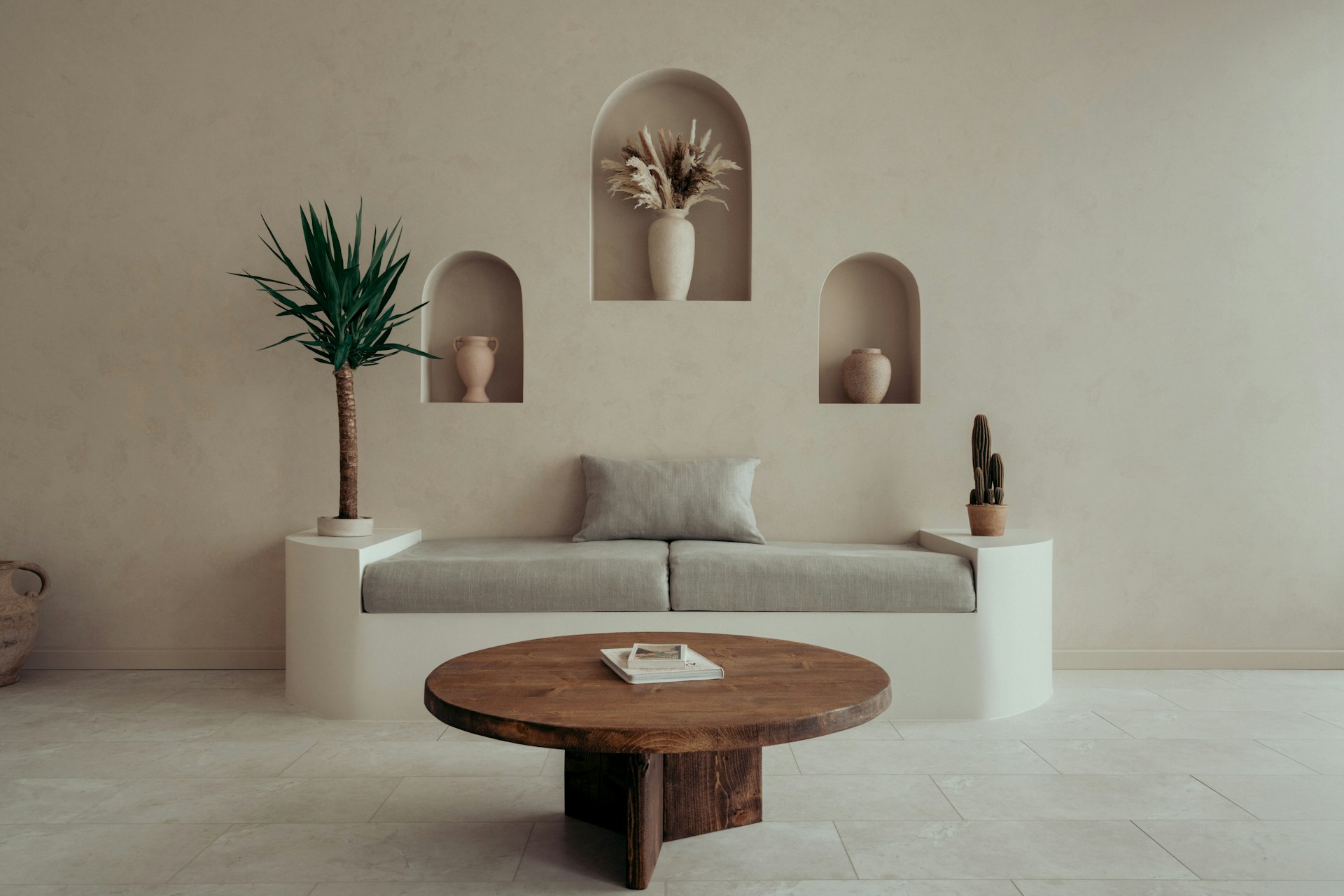 A finished, styled room with arched niches
